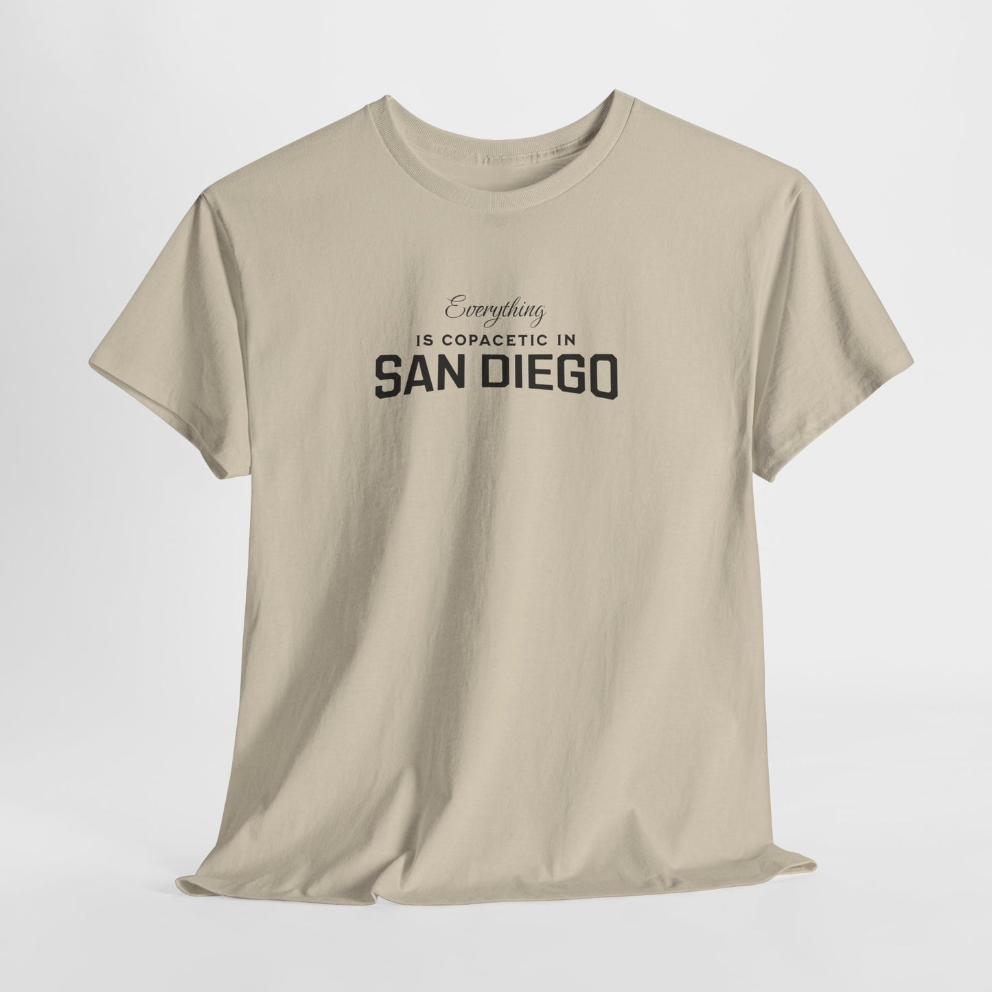 Beige t-shirt with text 'Everything is copacetic in San Diego' on a white background