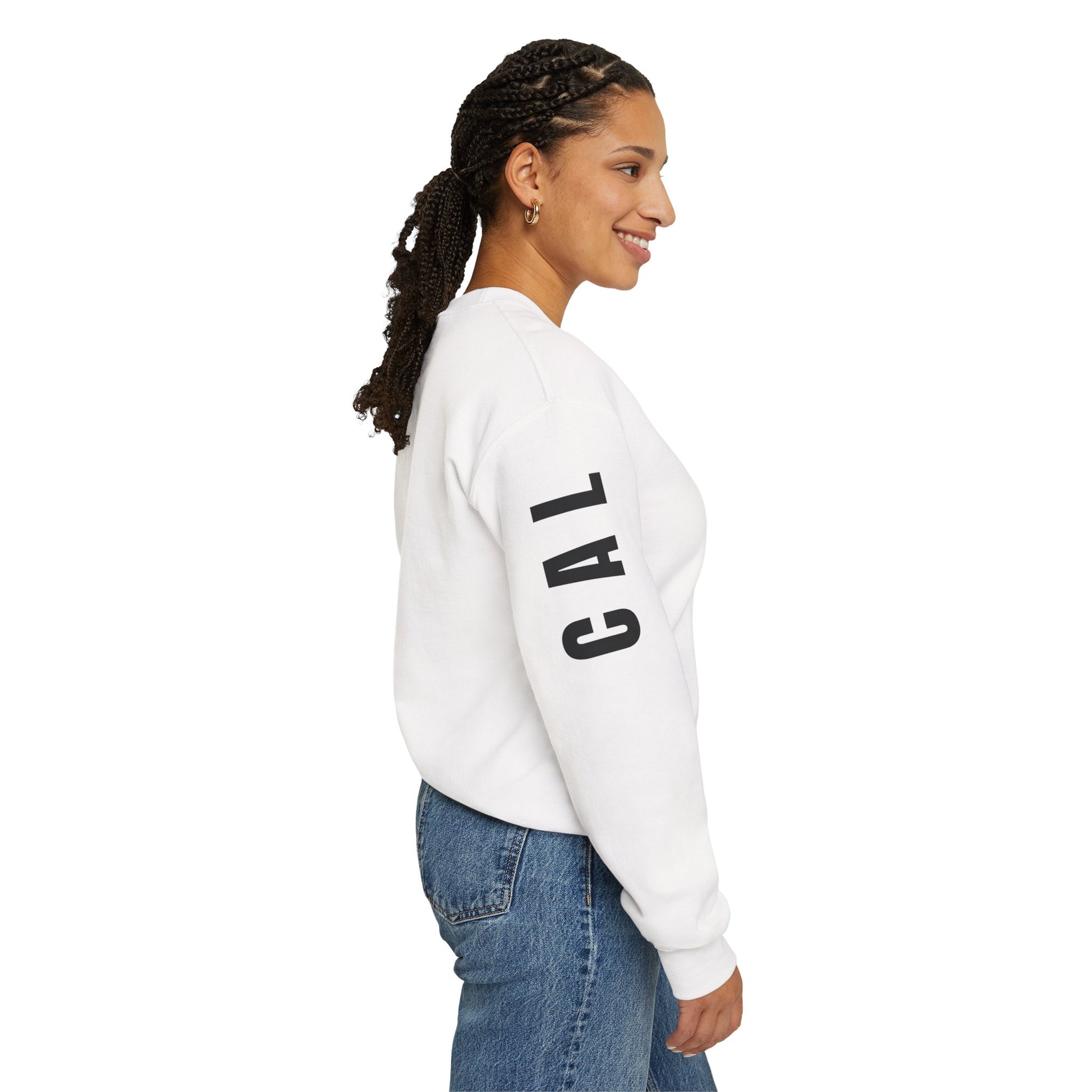 Woman wearing a white sweatshirt with 'CAL' printed on the sleeve against a white background