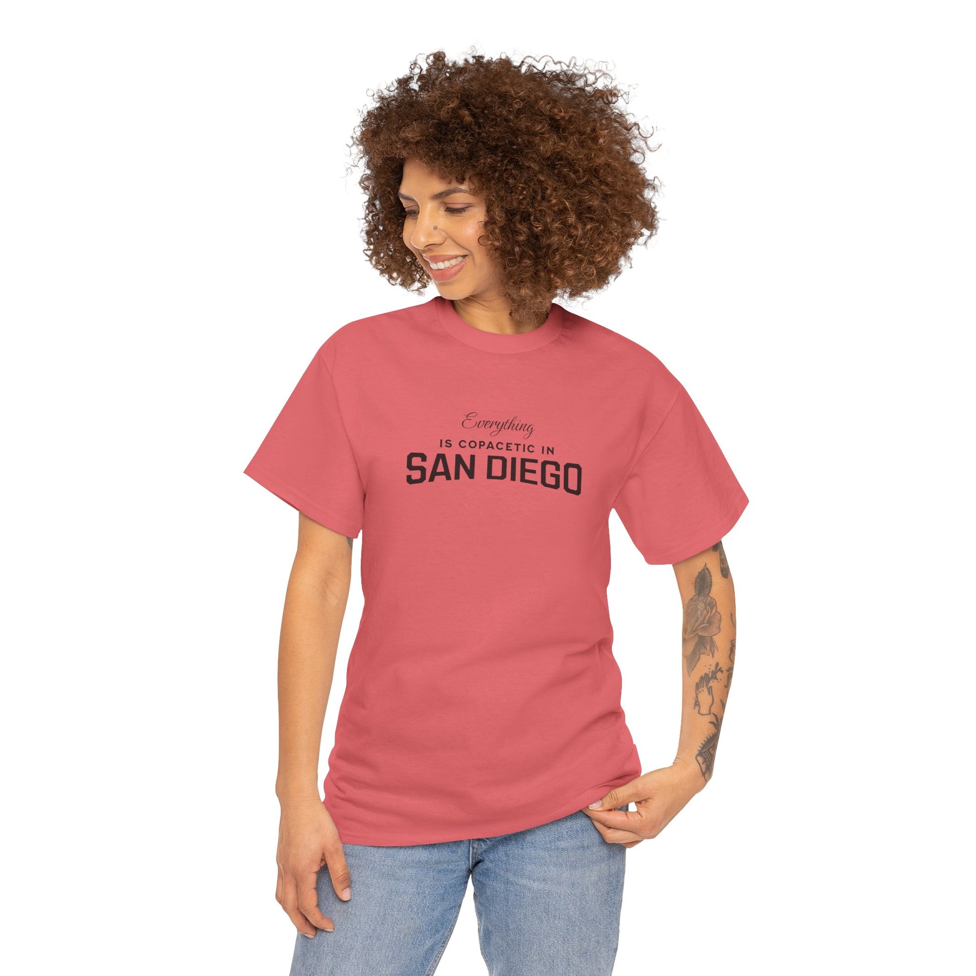 Woman wearing a red t-shirt with 'Everything is Copacetic in San Diego' text on a white background