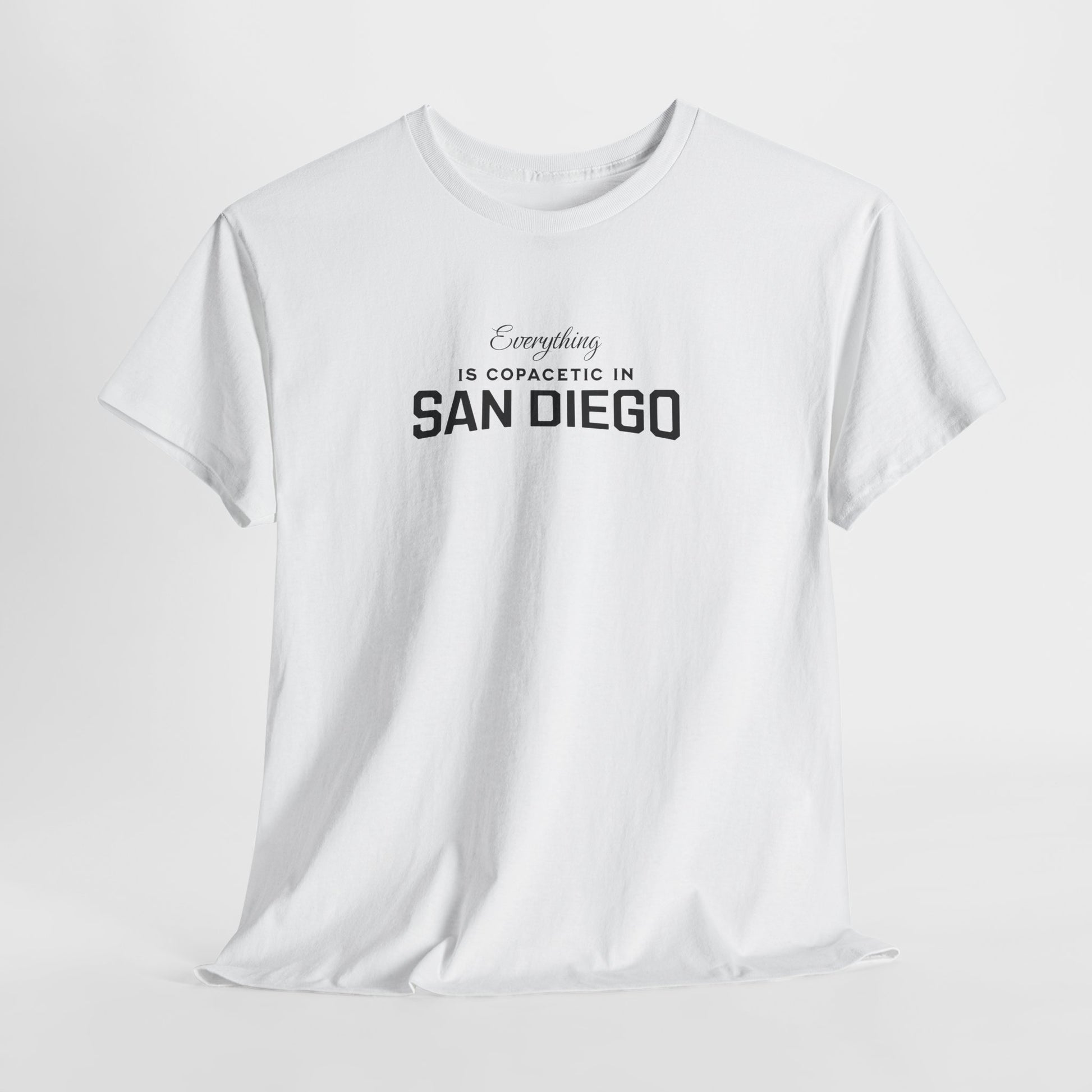 White t-shirt with text 'Everything is copacetic in San Diego' on a light gray background