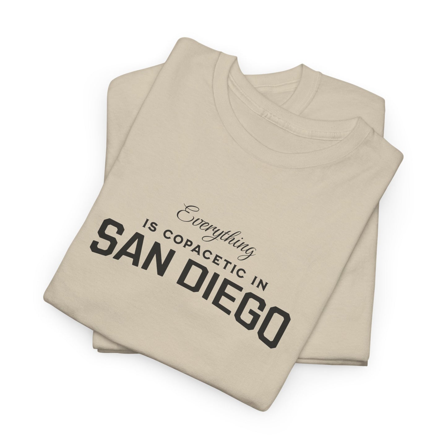 Beige t-shirt with text 'Everything is copacetic in San Diego' on a white background