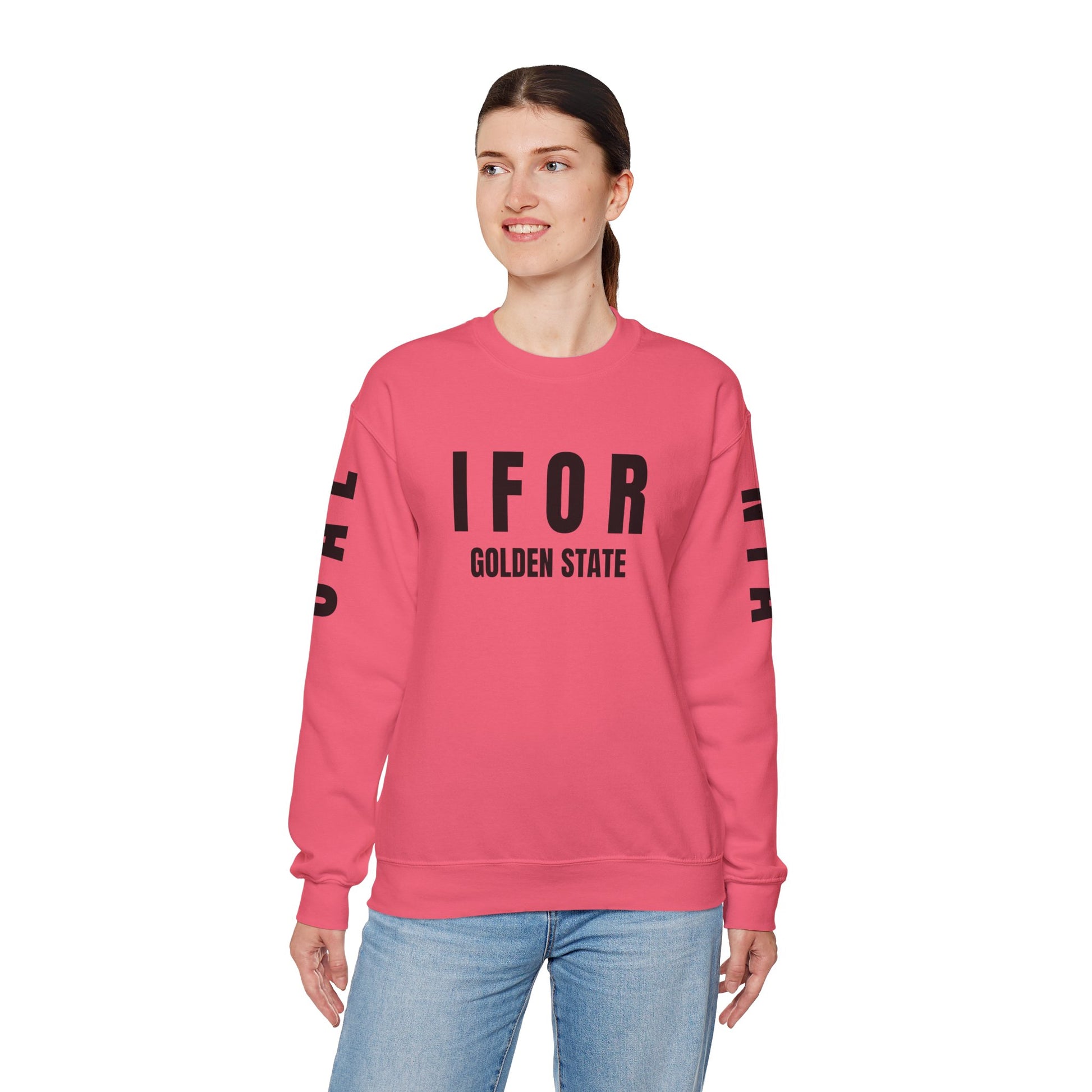 Person wearing a pink sweatshirt with text on a white background
