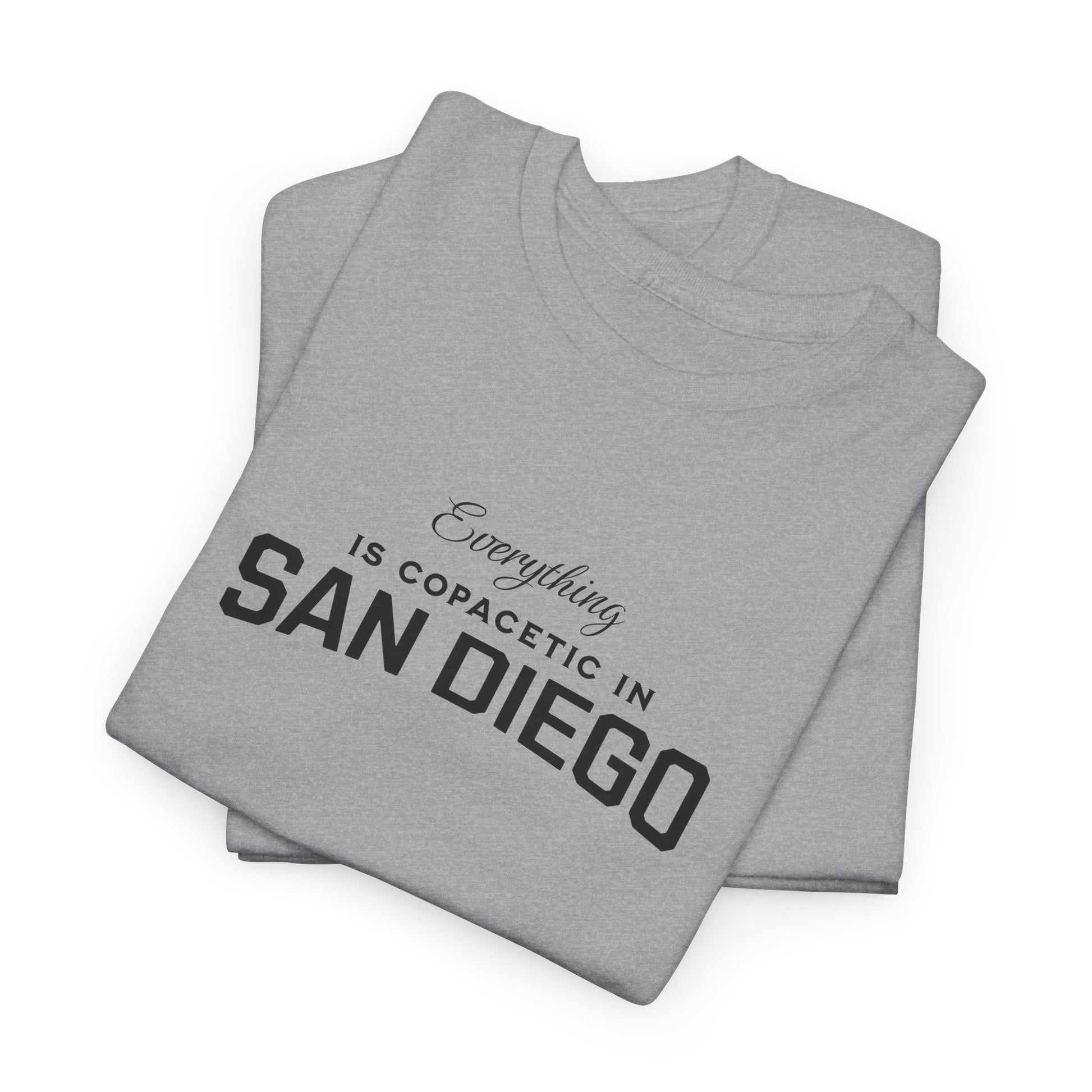 Folded gray t-shirt with text 'Everything is copacetic in San Diego' on a white background